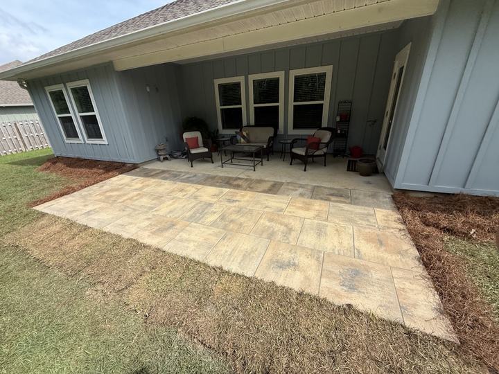 Large-format paver patio extending a covered back porch
